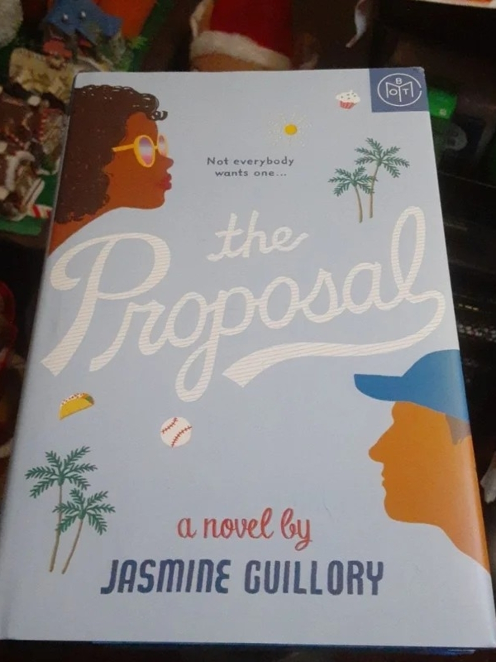 The Proposal by Jasmine Guillory - Light Blue Hardcover Coffee Table Book